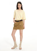 Distressed washed utility denim mini skirt